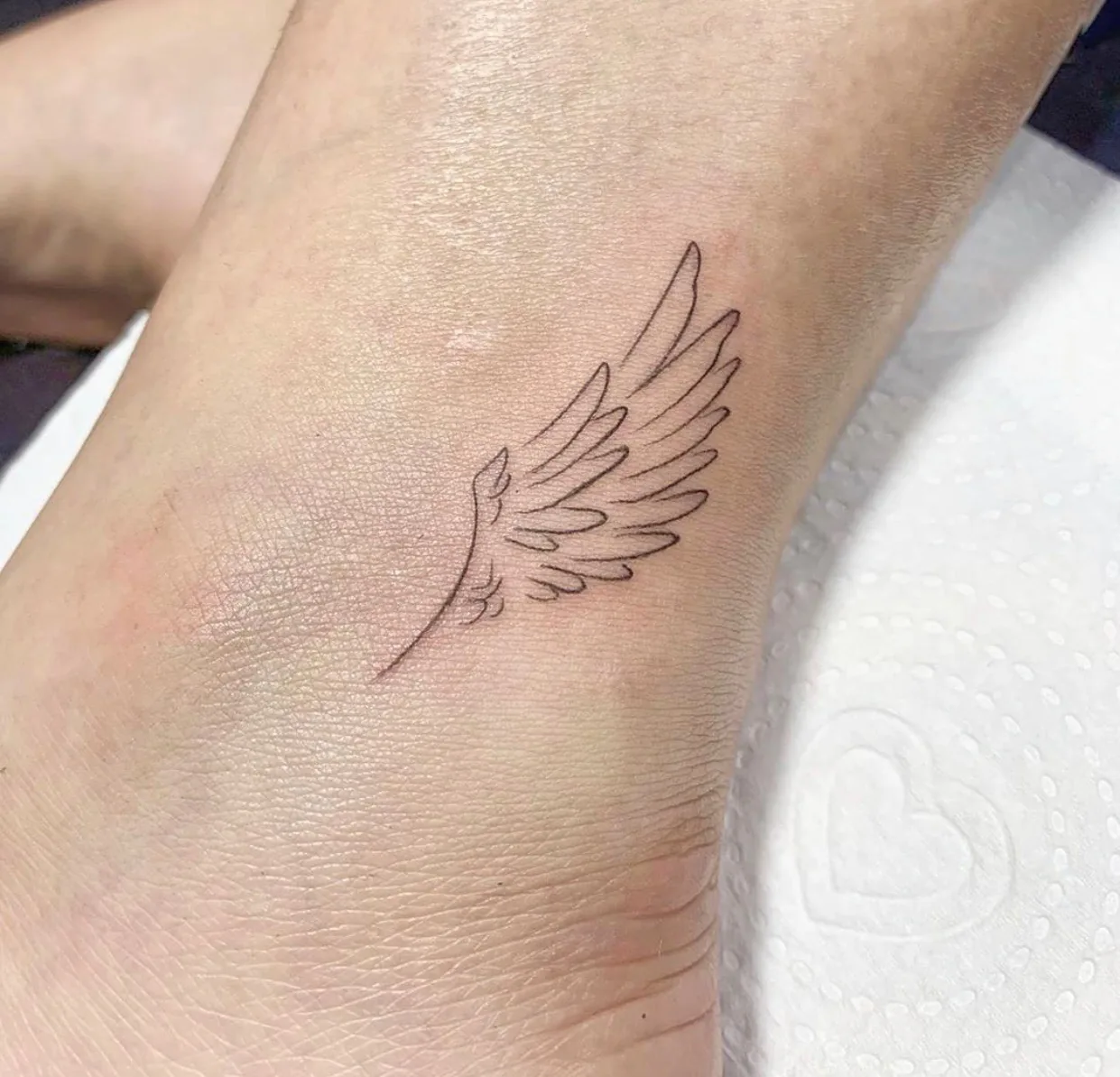 Angel wing wrist Women's angel wing fineline wrist tattoo Paris – Showtime Tattoo