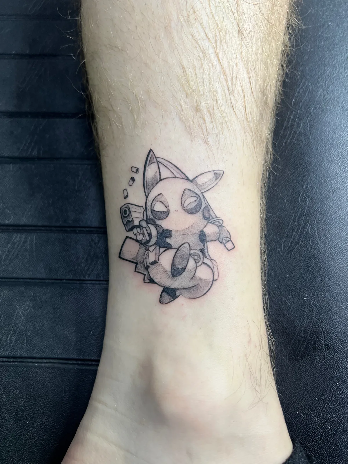 Anime tattoo Deadpool Pikachu ankle Paris – Showtime Tattoo