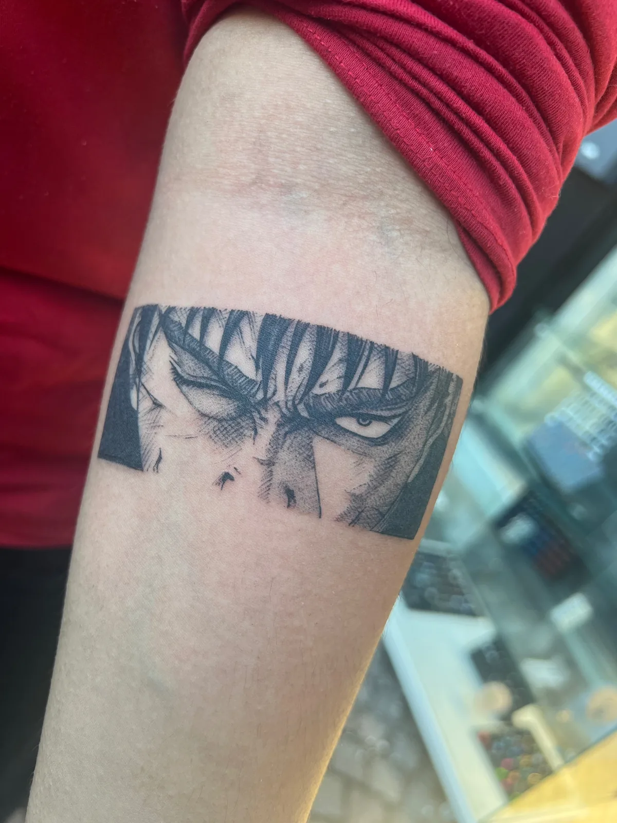 Anime tattoo angry gaze blackwork arm Paris – Showtime Tattoo