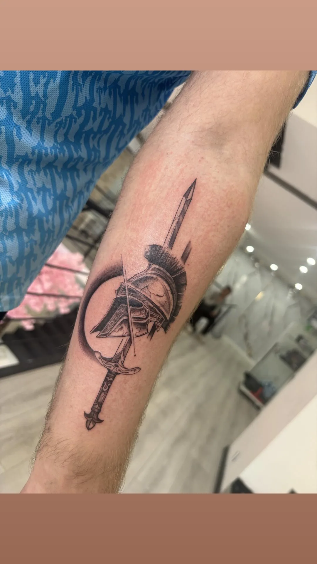 Men's spartan helmet sword blackwork tattoo Paris – Showtime Tattoo