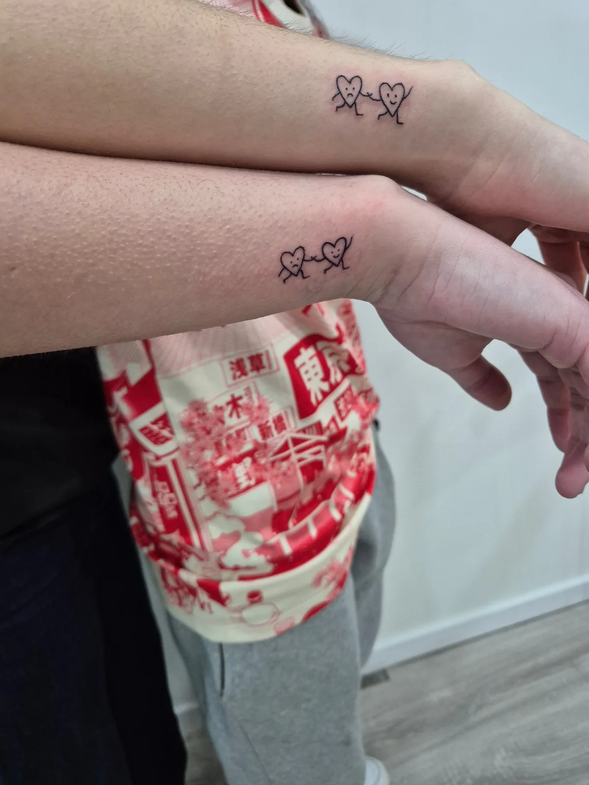 Couple hearts matching minimalist wrist tattoo Paris – Showtime Tattoo